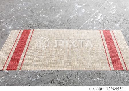 Perspective view of red tablecloth for food on cement background. Empty space for your design Perspective view of red tablecloth for food on cement background. Empty space for your design 139846244