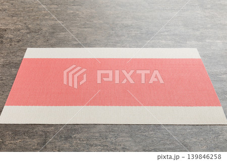 Perspective view of red tablecloth for food on cement background. Empty space for your design Perspective view of red tablecloth for food on cement background. Empty space for your design 139846258