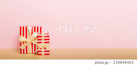 holiday paper present tied yellow ribbon bow top view with copy space. Flat lay holiday background. Birthday or christmas present. Christmas gift box concept with copy space 139846403