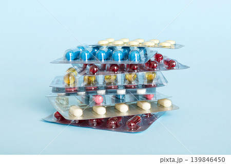 too many different pill cartridges stacked. selective Focus. Packs of blister pills with tablets. Colored pastilles packages. A pile of medicine in blister packs. Pharmaceutical blister packs too many different pill cartridges stacked. selective Focus. Packs of blister pills with tablets. Colored pastilles packages. A pile of medicine in blister packs. Pharmaceutical blister packs 139846450