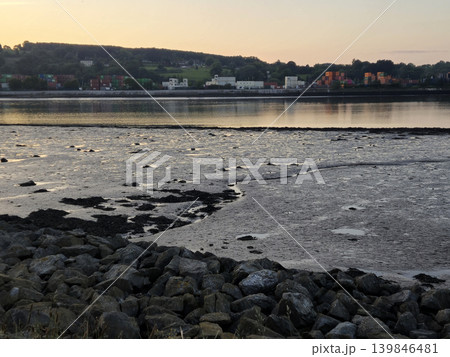 Calm Lake at Dusk with Sunlight Reflection 139846481