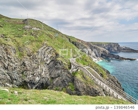 Coastal cliff path along rugged sea shoreline Coastal cliff path along rugged sea shoreline 139846546