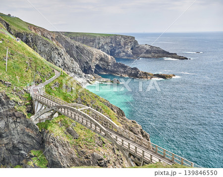 Cliffside coastal path above turquoise sea Cliffside coastal path above turquoise sea 139846550