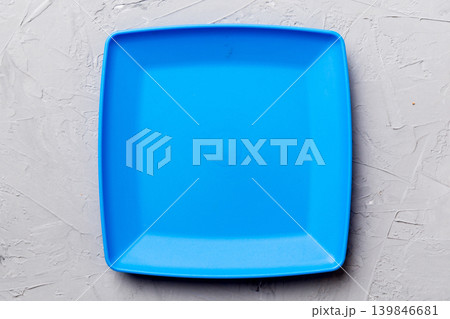 Top view of empty square plate on cement background. Empty space for your design Top view of empty square plate on cement background. Empty space for your design 139846681