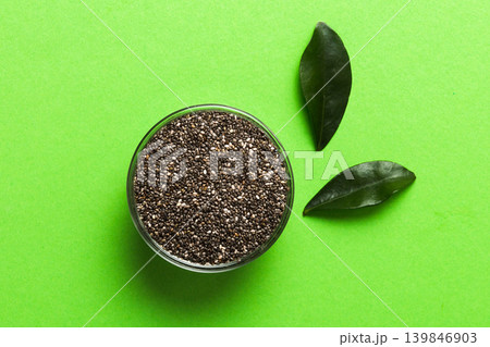 Chia seeds in bowl on colored background. Healthy Salvia hispanica in small bowl. Healthy superfood 139846903