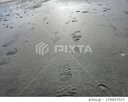 Human footprints on beach sand 139847025