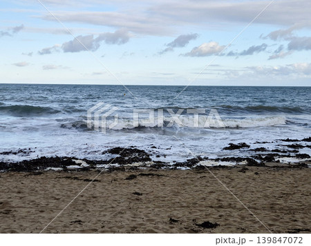 Empty Ocean Beach With Stormy Waves Background 139847072