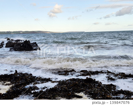 Empty Ocean Beach With Stormy Waves Background 139847076