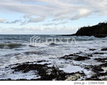 Empty Ocean Beach With Stormy Waves Background 139847080