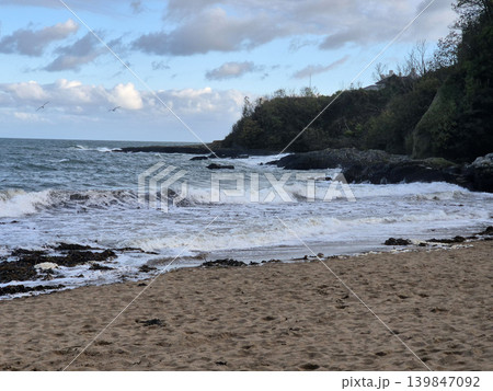 Empty Ocean Beach With Stormy Waves Background 139847092