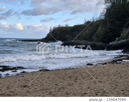 Empty Ocean Beach With Stormy Waves Background 139847094