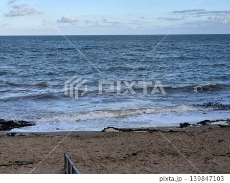 Empty Ocean Beach With Stormy Waves Background 139847103