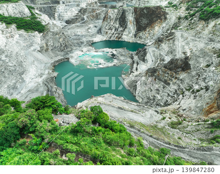 Open pit mine industry. Limestone quarry. Mining industry and construction material supply. Landscape of resource extraction in a industrial site 139847280