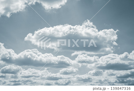 Dramatic overcast sky with gray clouds forming moody and tranquil backdrop before rain, capturing the serene yet stormy atmosphere in the cloudy weather of the rainy season. Moody and peaceful scene. 139847316