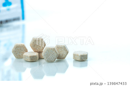 Hexagon medical lozenges tablet with Brazilian green propolis extract for cough sore throat and irritation relief in natural healthcare and pharmaceutical treatment. Medical and natural remedy. Hexagon medical lozenges tablet with Brazilian green propolis extract for cough sore throat and irritation relief in natural healthcare and pharmaceutical treatment. Medical and natural remedy. 139847433
