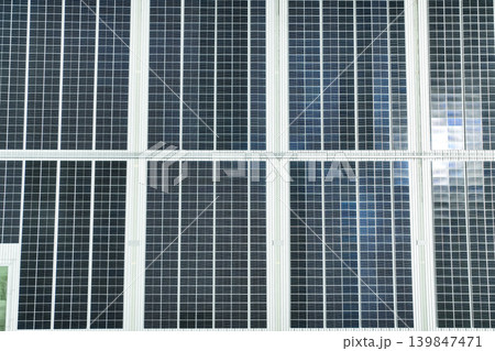 Solar energy for factory and warehouse building. Solar panels on roof of industrial plant. Commercial solar power. Rooftop solar power. Rooftop renewable energy system. Sustainable green energy. Solar energy for factory and warehouse building. Solar panels on roof of industrial plant. Commercial solar power. Rooftop solar power. Rooftop renewable energy system. Sustainable green energy. 139847471