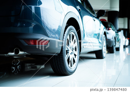Car parked in luxury showroom. Car dealership office. Car showroom business. New car parked in modern showroom. Auto for sale and rent business. Automobile leasing and insurance. Electric automobile. Car parked in luxury showroom. Car dealership office. Car showroom business. New car parked in modern showroom. Auto for sale and rent business. Automobile leasing and insurance. Electric automobile. 139847480