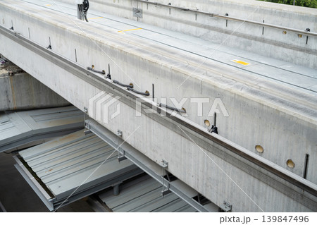 Elevated railway track construction. Concrete beams and steel support structure with prefabricated platform. Modern urban mass transit infrastructure development project. Urban public transportation. 139847496