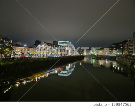 Night City Buildings Reflections In City River With Colorful Lights And Bridges, Cork City In Ireland At Night Night City Buildings Reflections In City River With Colorful Lights And Bridges, Cork City In Ireland At Night 139847565