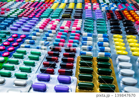 Colorful of tablets and capsules pill in blister packaging arranged with beautiful pattern. Pharmaceutical industry concept. Pharmacy drugstore. Defective and error in pharmaceutical factory concept. Colorful of tablets and capsules pill in blister packaging arranged with beautiful pattern. Pharmaceutical industry concept. Pharmacy drugstore. Defective and error in pharmaceutical factory concept. 139847670