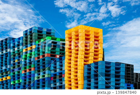 Pile of plastic shipping pallet. Industrial plastic pallet stacked at factory warehouse. Cargo and shipping concept. Plastic pallet rack for export delivery industry. Plastic pallet storage warehouse. 139847840
