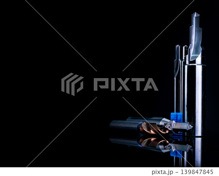 Special tools isolated on black background. Made to order special tools. Coated step drill and reamer detail. HSS cemented carbide. Carbide cutting tool for industrial applications. Engineering tools. Special tools isolated on black background. Made to order special tools. Coated step drill and reamer detail. HSS cemented carbide. Carbide cutting tool for industrial applications. Engineering tools. 139847845