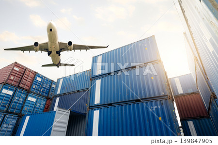 Air logistics. Cargo airplane flying above stack of logistic container. Cargo and shipping business. Container ship for export logistic. Logistic industry from port to port. Freight transportation. 139847905