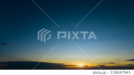 Dramatic golden and dark blue sunset sky abstract background. Dark blue sky in the evening. Sky at dusk. Sunset abstract background. Dusk and dawn concept. Beauty in nature.Majestic sky for wallpaper. Dramatic golden and dark blue sunset sky abstract background. Dark blue sky in the evening. Sky at dusk. Sunset abstract background. Dusk and dawn concept. Beauty in nature.Majestic sky for wallpaper. 139847943