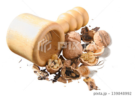 Wooden Nutcracker With Cracked Walnuts and Shells, Rustic Kitchen Tool and Healthy Snack Ingredients Wooden Nutcracker With Cracked Walnuts and Shells, Rustic Kitchen Tool and Healthy Snack Ingredients 139848992