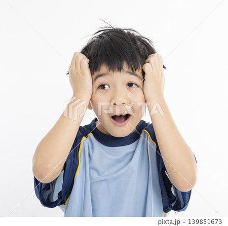 The boy's embarrassed expression 139851673