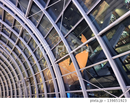Glass canopy showcasing repeating geometric frames and day light 139851923