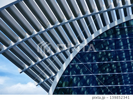 Glass canopy showcasing repeating geometric frames and day light Glass canopy showcasing repeating geometric frames and day light 139852341