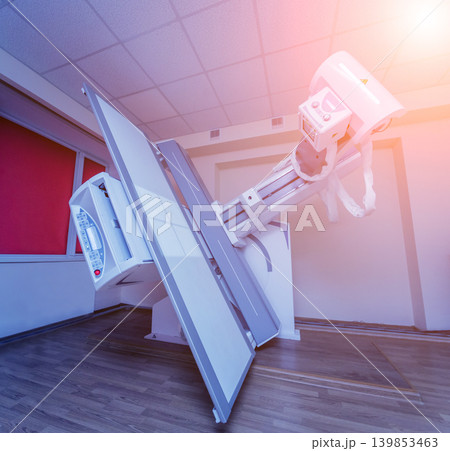 X-ray room in a hospital. Classic ceiling-mounted x-ray system. X-ray room in a hospital. Classic ceiling-mounted x-ray system. 139853463