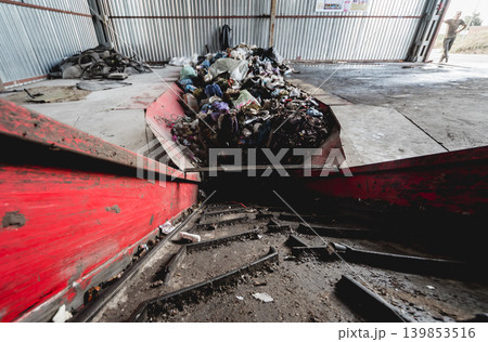 At modern recycling plant. Conveyor belt for transports garbage At modern recycling plant. Conveyor belt for transports garbage 139853516