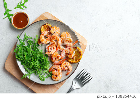 Grilled shrimps, prawns with arugula Grilled shrimps, prawns with arugula 139854416