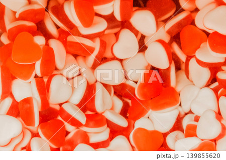 Gummies jelly sweet sugar marmalade white food candy red color background 139855620