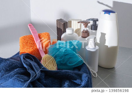 Set washing body and hair in the bathroom. Towel and washcloth, Bottles of shampoo, lotion and liquid soap. Shower gel. Set washing body and hair in the bathroom. Towel and washcloth, Bottles of shampoo, lotion and liquid soap. Shower gel. 139856198