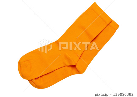 A pair of thin yellow cotton socks, on a white background, flat lay, isolated A pair of thin yellow cotton socks, on a white background, flat lay, isolated 139856392