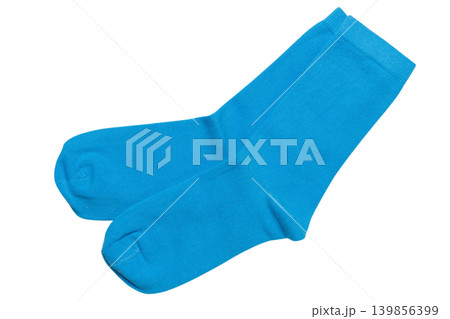 A pair of thin blue cotton socks laid out on a flat background, top view. 139856399