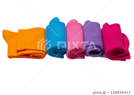 Set of thin multi-colored cotton socks rolled in pairs, side view, on white background, isolated. Set of thin multi-colored cotton socks rolled in pairs, side view, on white background, isolated. 139856411