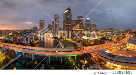 Tampa, Florida. Cars traffic driving on highway bridge and high skyscraper buildings in downtown district. American city with business financial district at nightfall. 139856693