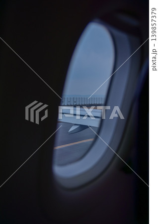 Looking from the airplane window with stunning skyscapes and landscape with airplane wing. Travel and transportation concept. 139857379
