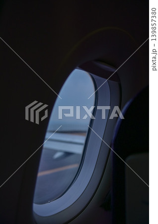 Looking from the airplane window with stunning skyscapes and landscape with airplane wing. Travel and transportation concept. Looking from the airplane window with stunning skyscapes and landscape with airplane wing. Travel and transportation concept. 139857380
