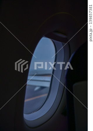 Looking from the airplane window with stunning skyscapes and landscape with airplane wing. Travel and transportation concept. Looking from the airplane window with stunning skyscapes and landscape with airplane wing. Travel and transportation concept. 139857381