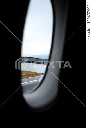 Looking from the airplane window with stunning skyscapes and landscape with airplane wing. Travel and transportation concept. Looking from the airplane window with stunning skyscapes and landscape with airplane wing. Travel and transportation concept. 139857409