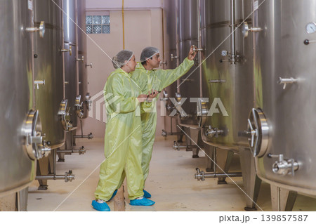 Winemaker working in modern large winery factory liquor drink industry quality. 139857587