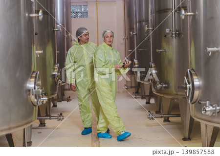 Winemaker working in modern large winery factory liquor drink industry quality. 139857588