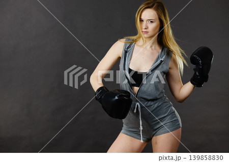Boxer girl exercise with boxing gloves. Boxer girl exercise with boxing gloves. 139858830