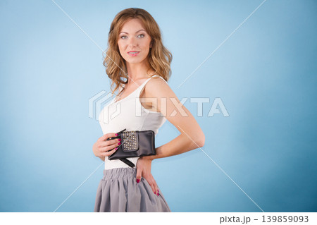 Elegant woman holding hand purse wallet 139859093
