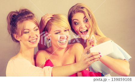 Fashionable women taking selfie Fashionable women taking selfie 139859108
